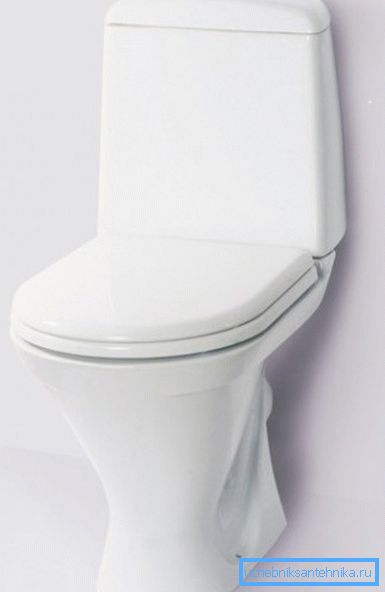 Na fotografii - WC s umývadlom umiestneným na miske. Na fotografii - WC s umývadlom umiestneným na miske.